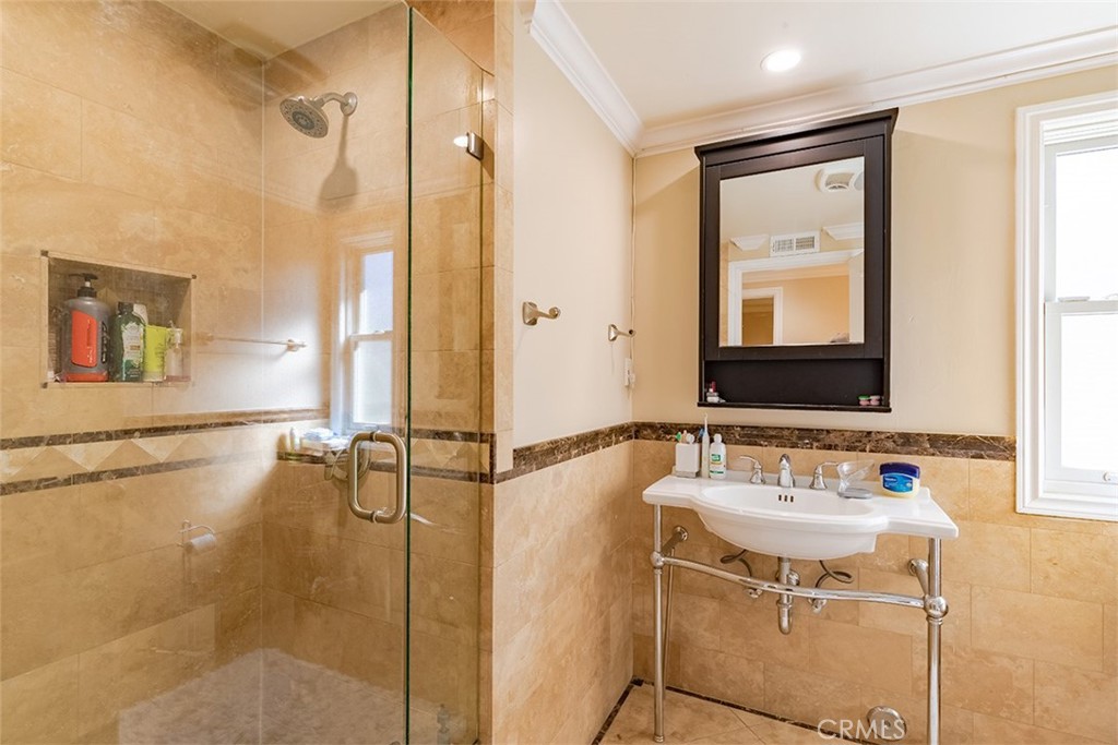 931 Rancho Circle Fullerton, CA 92835 - Photo 46 of 53 a bathroom with a sink and a mirror