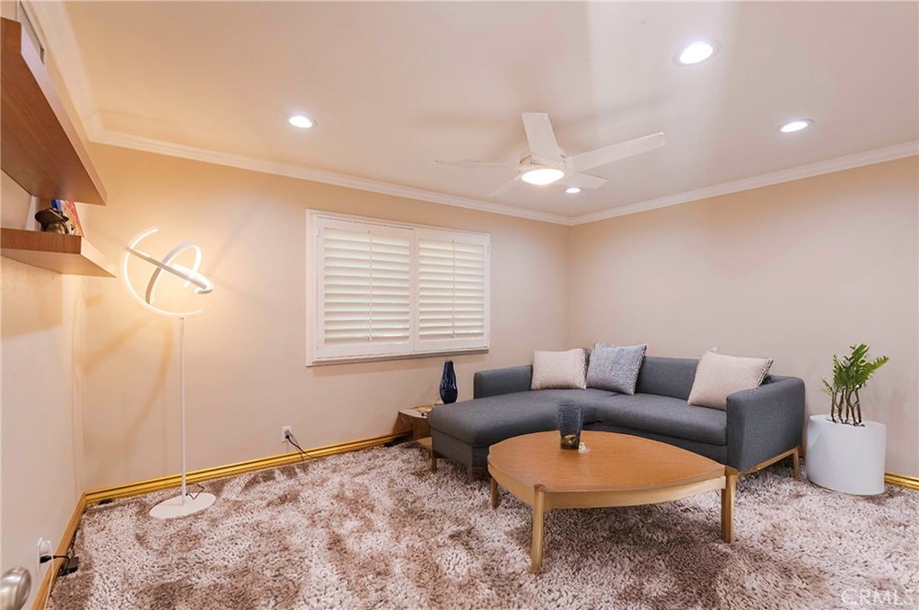 931 Rancho Circle Fullerton, CA 92835 - Photo 49 of 53 a living room with furniture a window and a flat screen tv