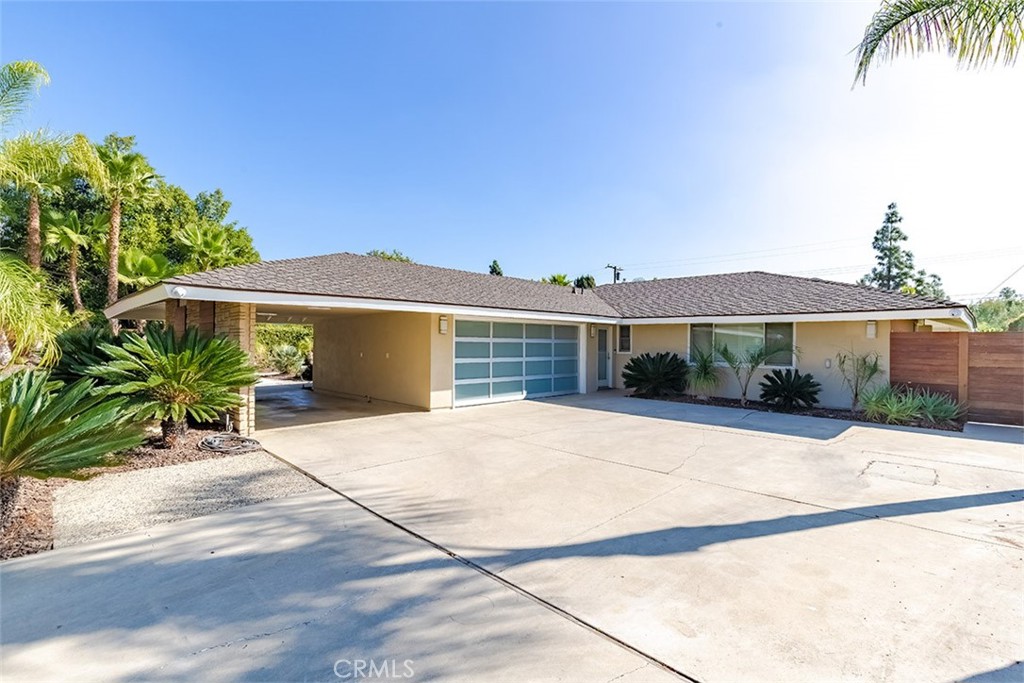 931 Rancho Circle Fullerton, CA 92835 - Photo 10 of 53 a front view of a house with a yard and garage