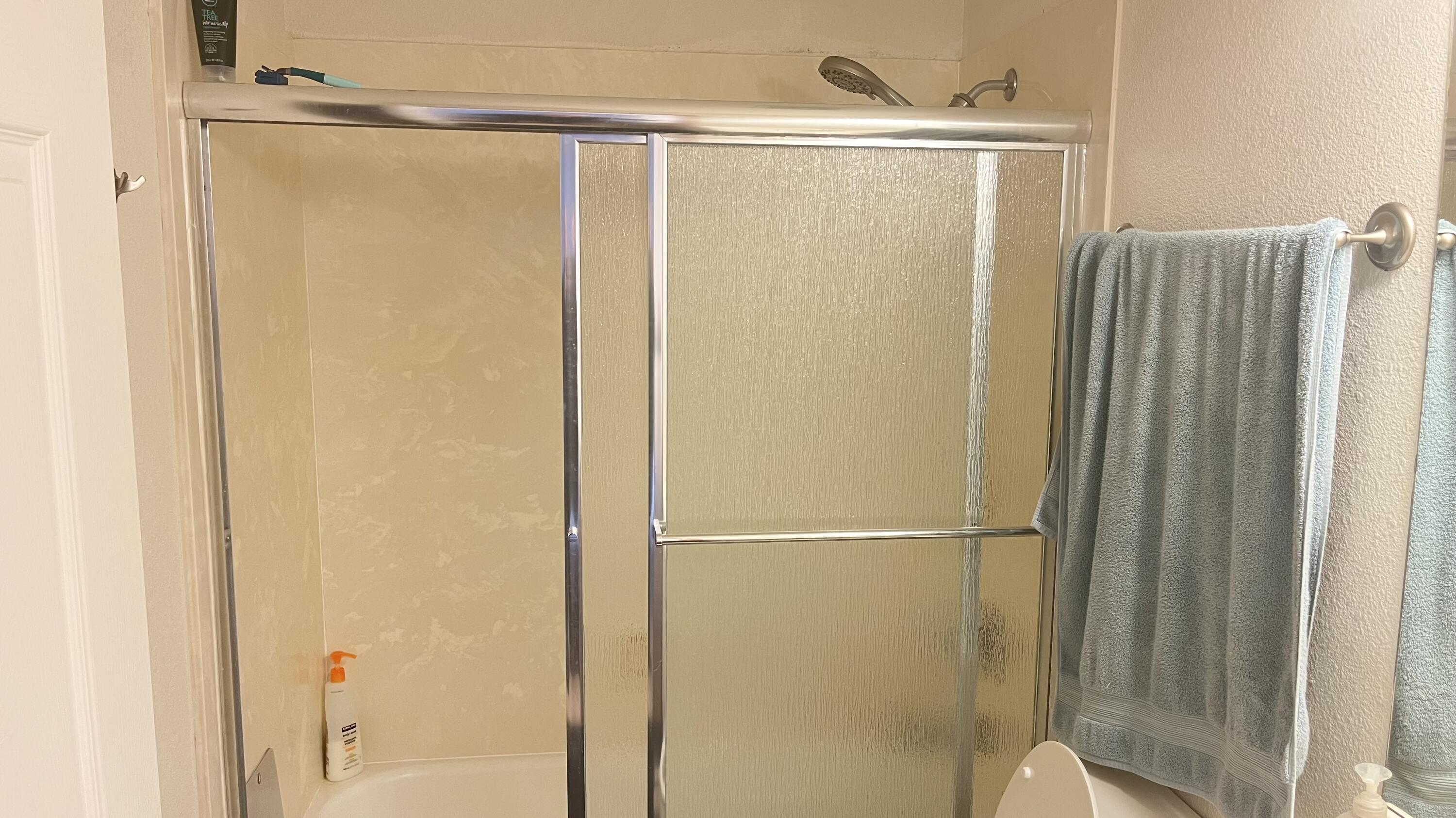 450 Midway Road, Unit 5 Medford, OR 97501 - Photo 29 of 46 a bathroom with a glass shower door