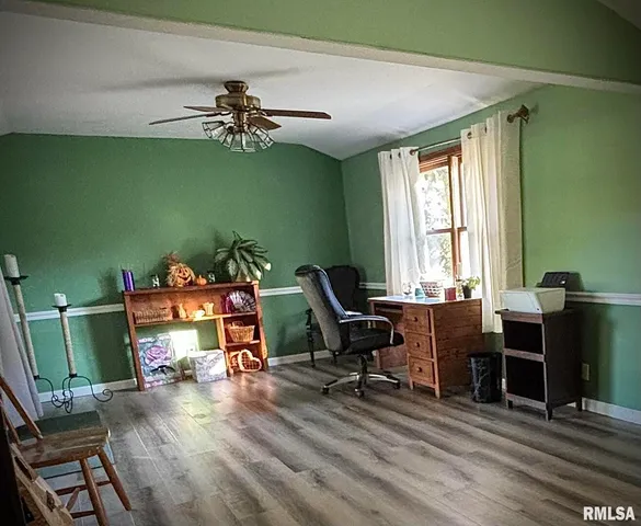 a workspace with furniture hardwood and a window