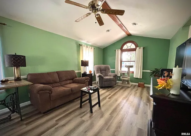 a living room with furniture and a window