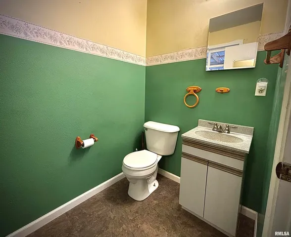 a bathroom with a toilet and a sink