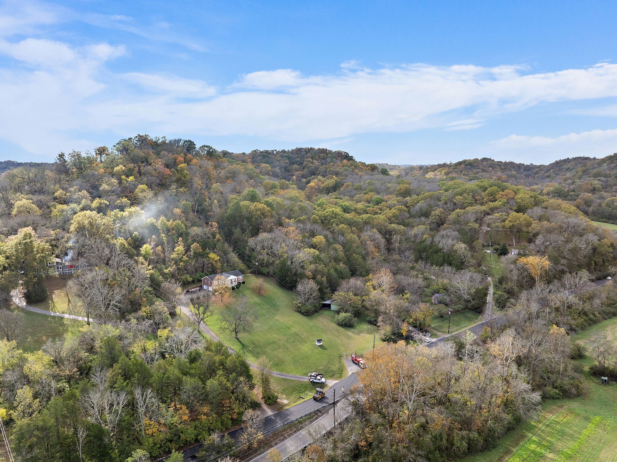 6916 River Rd Pike Nashville, TN 37209 - Photo 20 of 24 a view of a forest with mountains in the background
