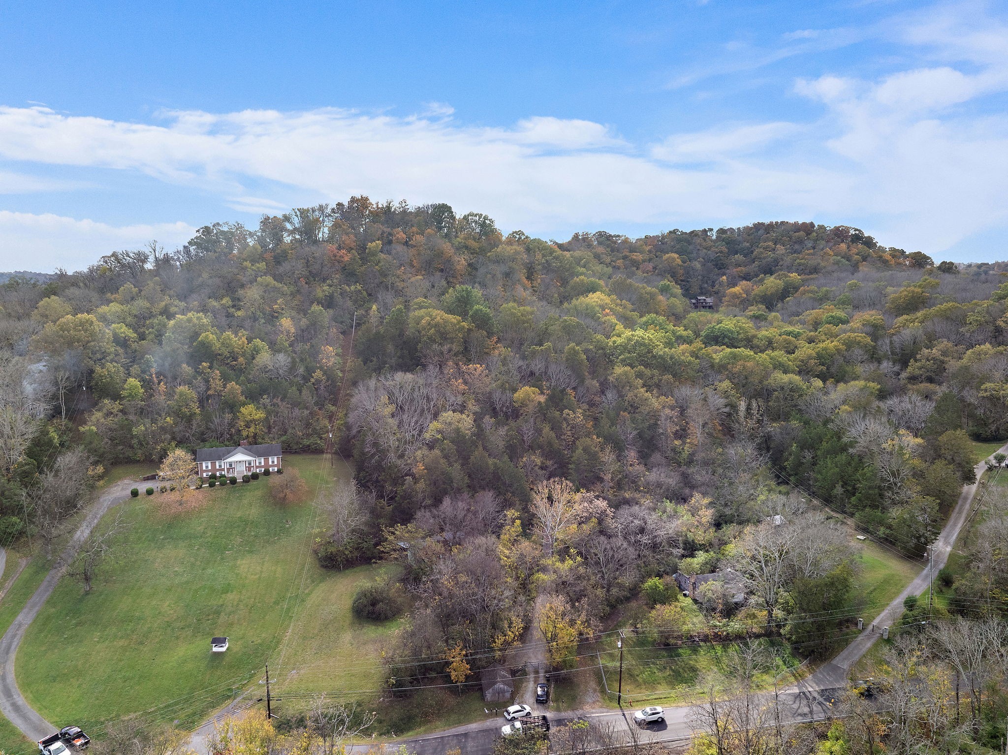 6916 River Rd Pike Nashville, TN 37209 - Photo 21 of 24 an aerial view of houses covered in trees