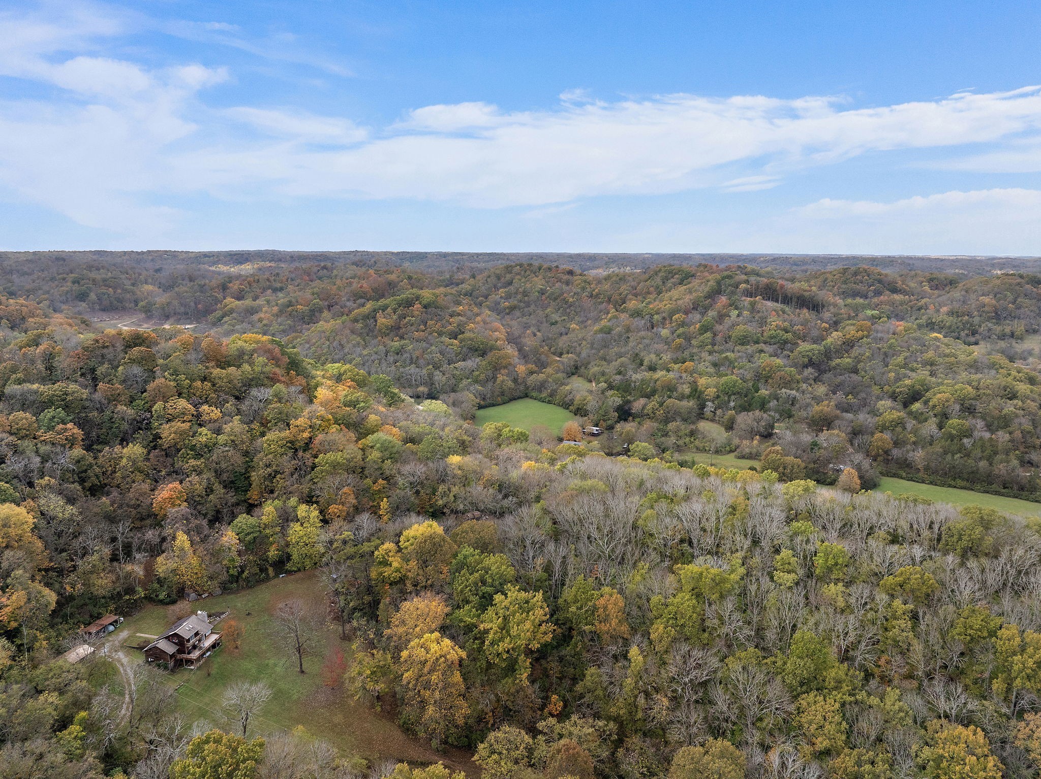 6916 River Rd Pike Nashville, TN 37209 - Photo 5 of 24 an aerial view of houses covered in trees