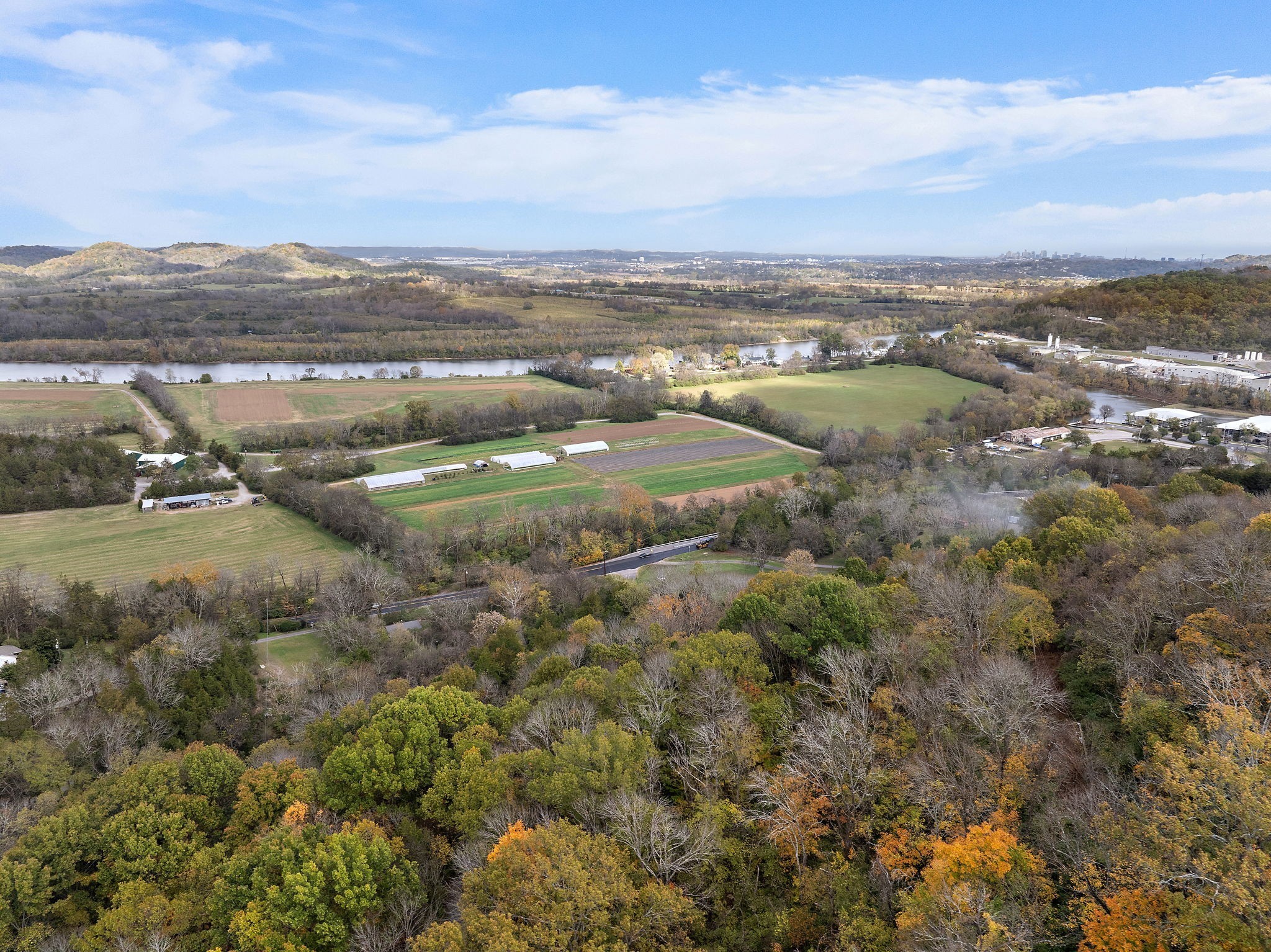 6916 River Rd Pike Nashville, TN 37209 - Photo 8 of 24 an aerial view of residential houses with outdoor space and trees