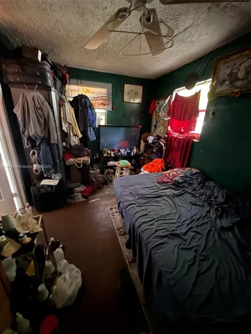 a bed sitting in a room next to a window