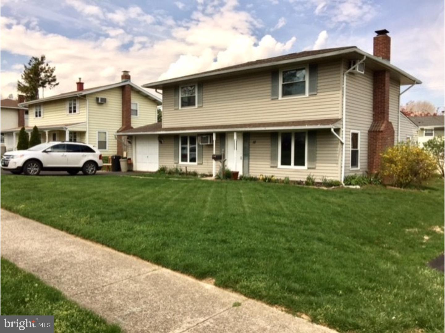 18 Tempo Road Levittown, PA 19056 - Photo 1 of 22 a front view of house with yard and green space