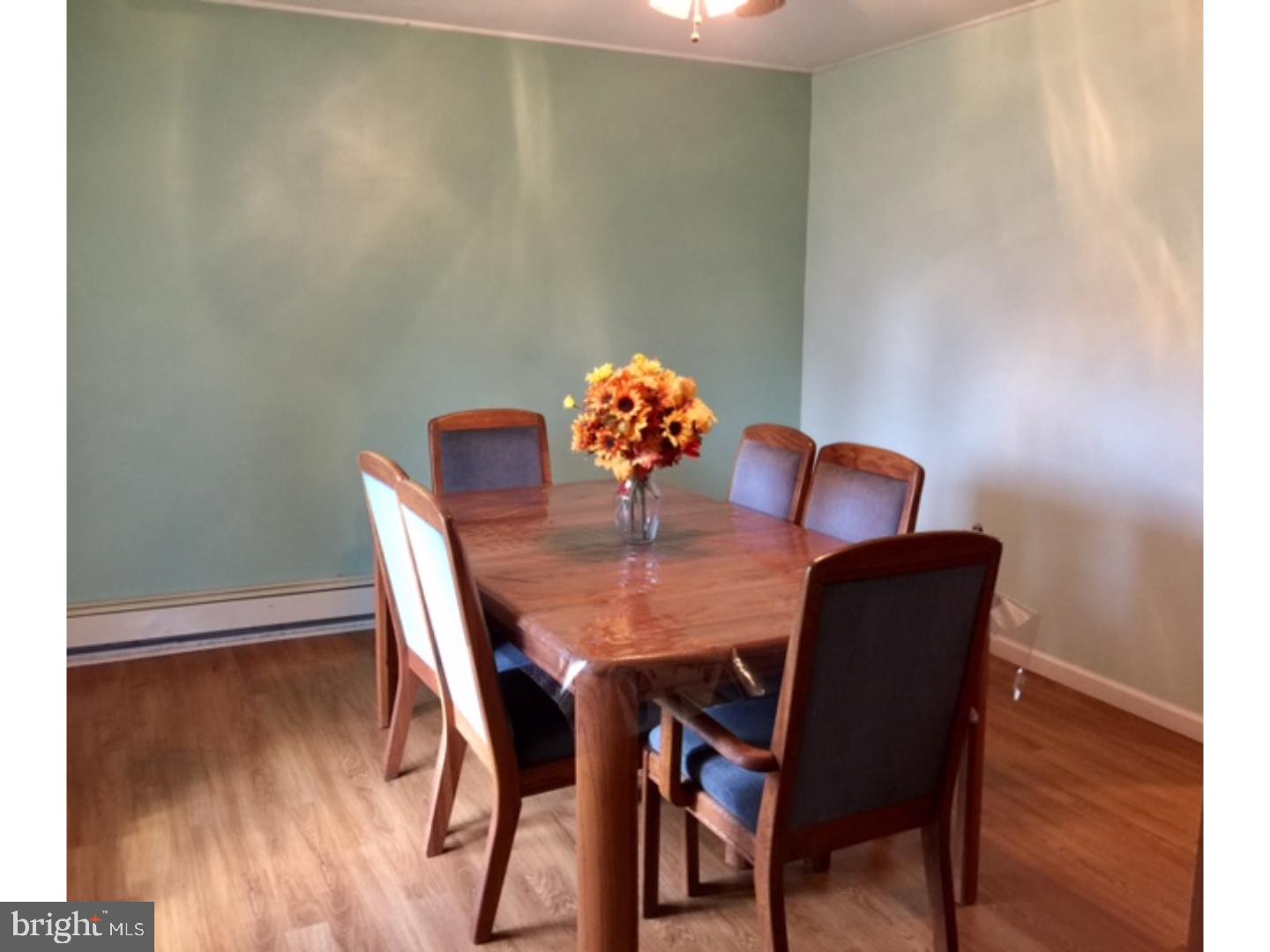 18 Tempo Road Levittown, PA 19056 - Photo 12 of 22 a view of a dining room with furniture and wooden floor