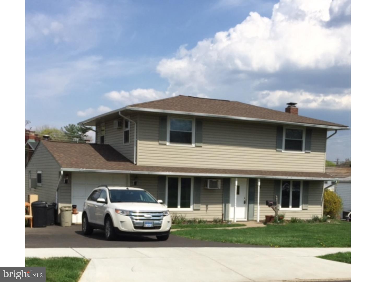 18 Tempo Road Levittown, PA 19056 - Photo 3 of 22 a front view of a house with cars parked