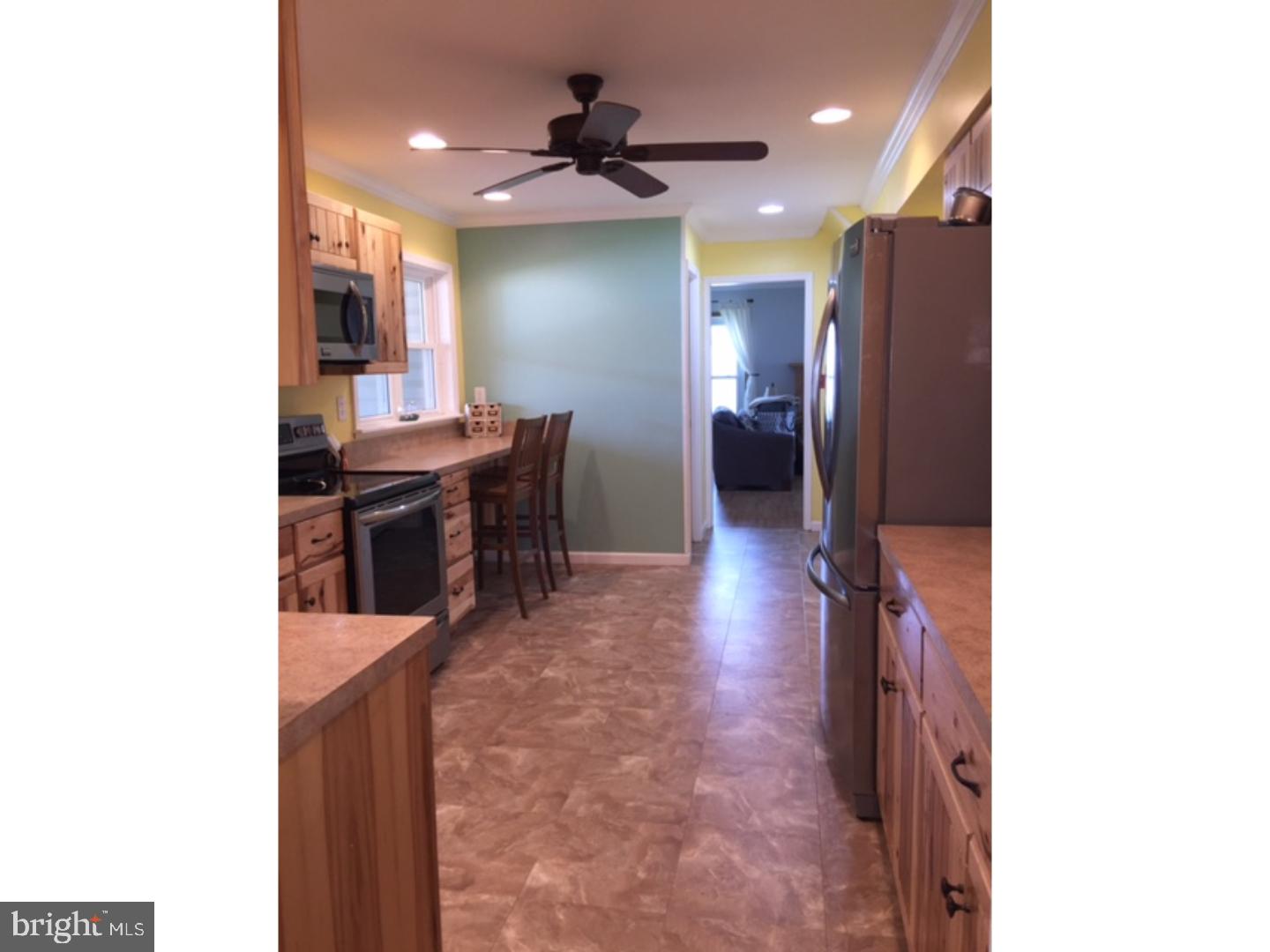 18 Tempo Road Levittown, PA 19056 - Photo 21 of 22 a view of kitchen with furniture and a refrigerator