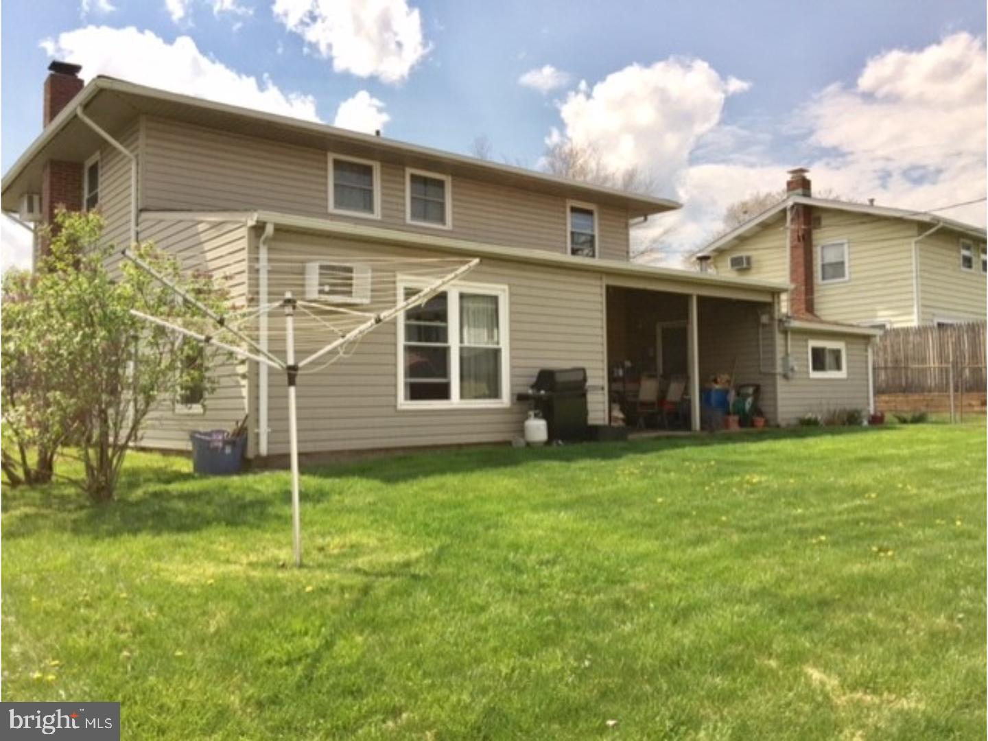 18 Tempo Road Levittown, PA 19056 - Photo 4 of 22 a backyard of a house with table and chairs