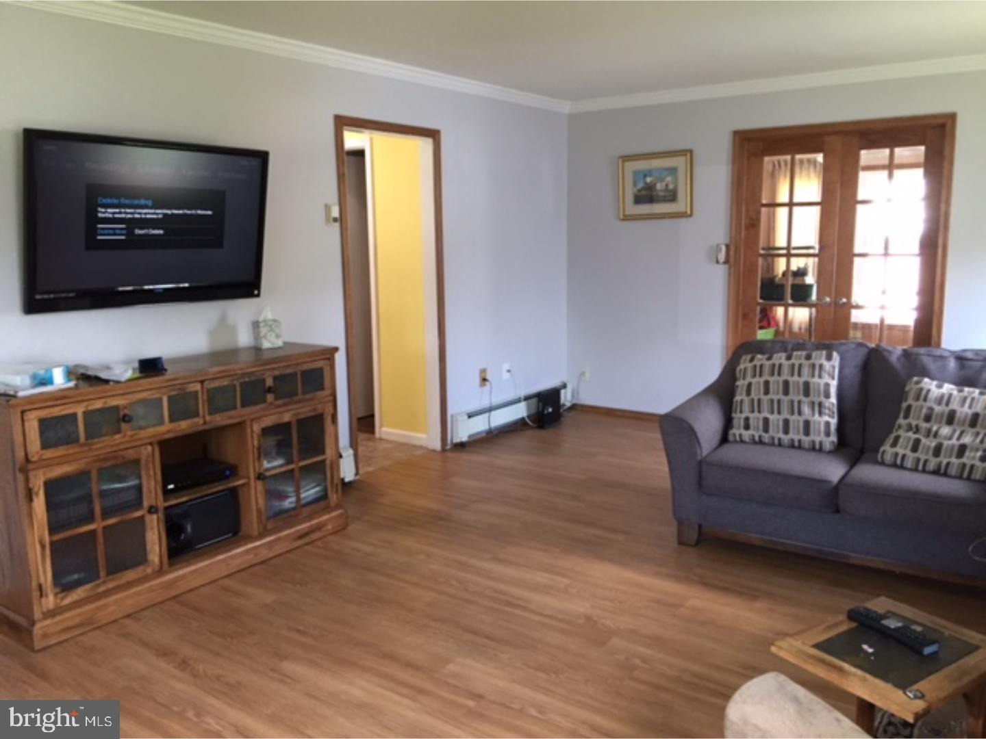 18 Tempo Road Levittown, PA 19056 - Photo 9 of 22 a living room with furniture and a flat screen tv