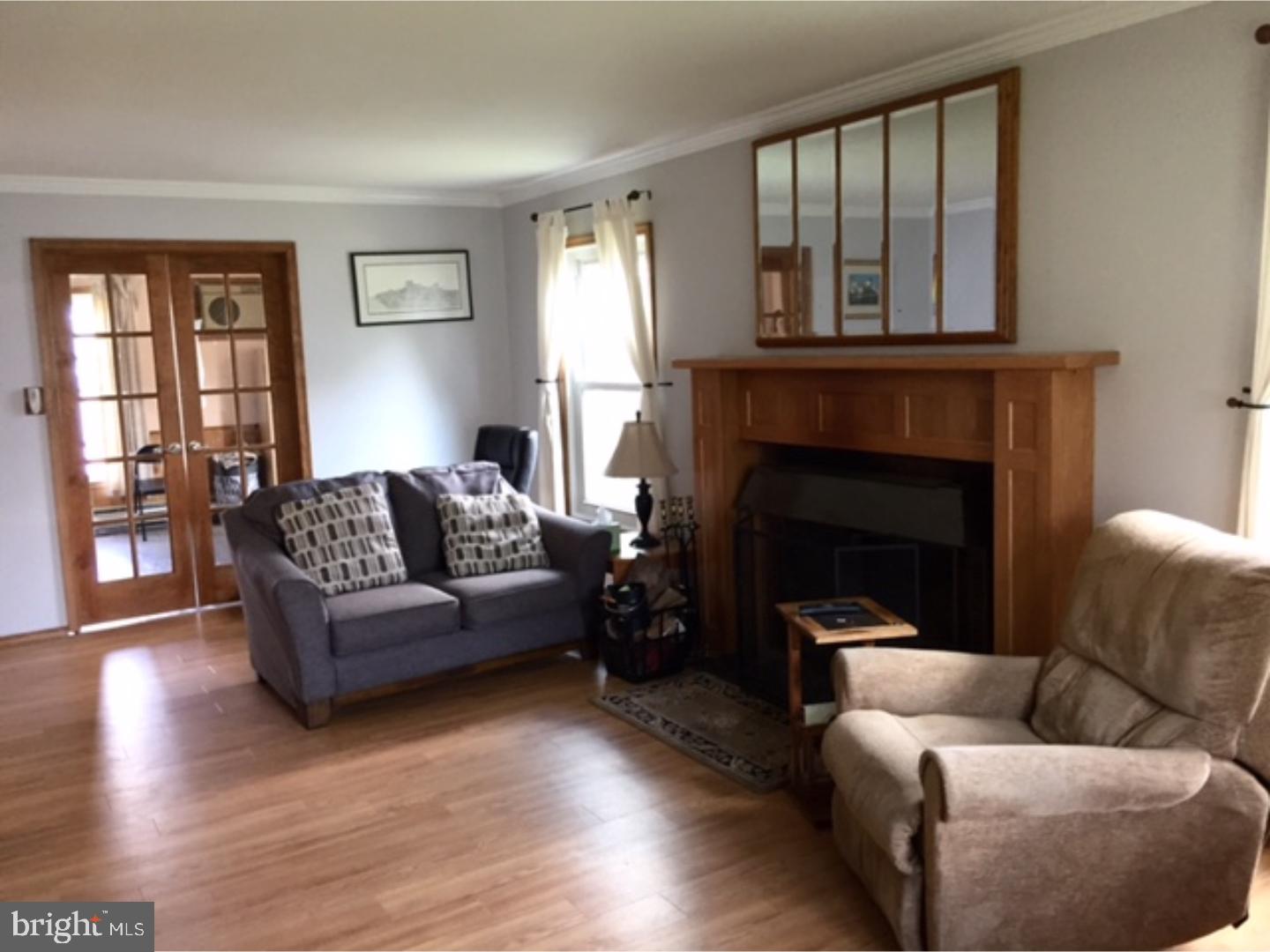 18 Tempo Road Levittown, PA 19056 - Photo 10 of 22 a living room with furniture and a fireplace