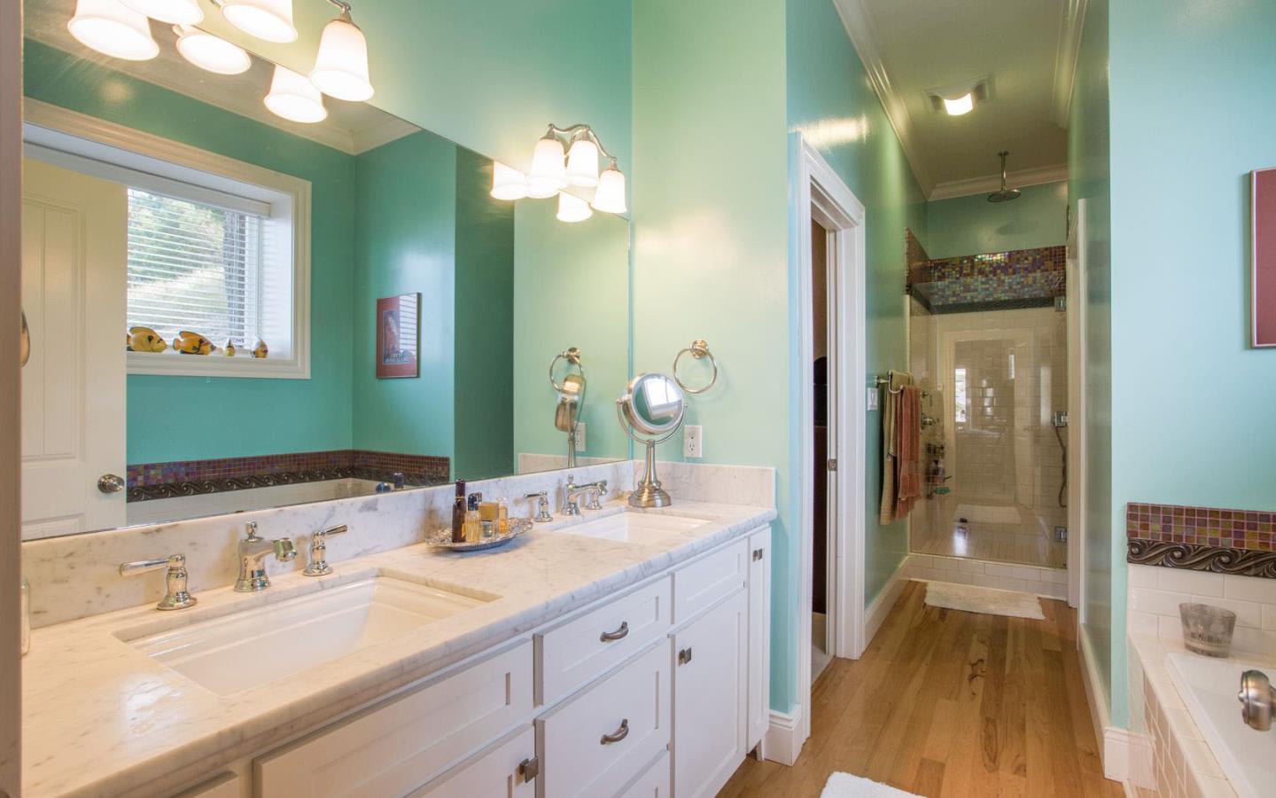 477 Clarendon Road Pacifica, CA 94044 - Photo 11 of 22 a spacious bathroom with a granite countertop sink and a mirror