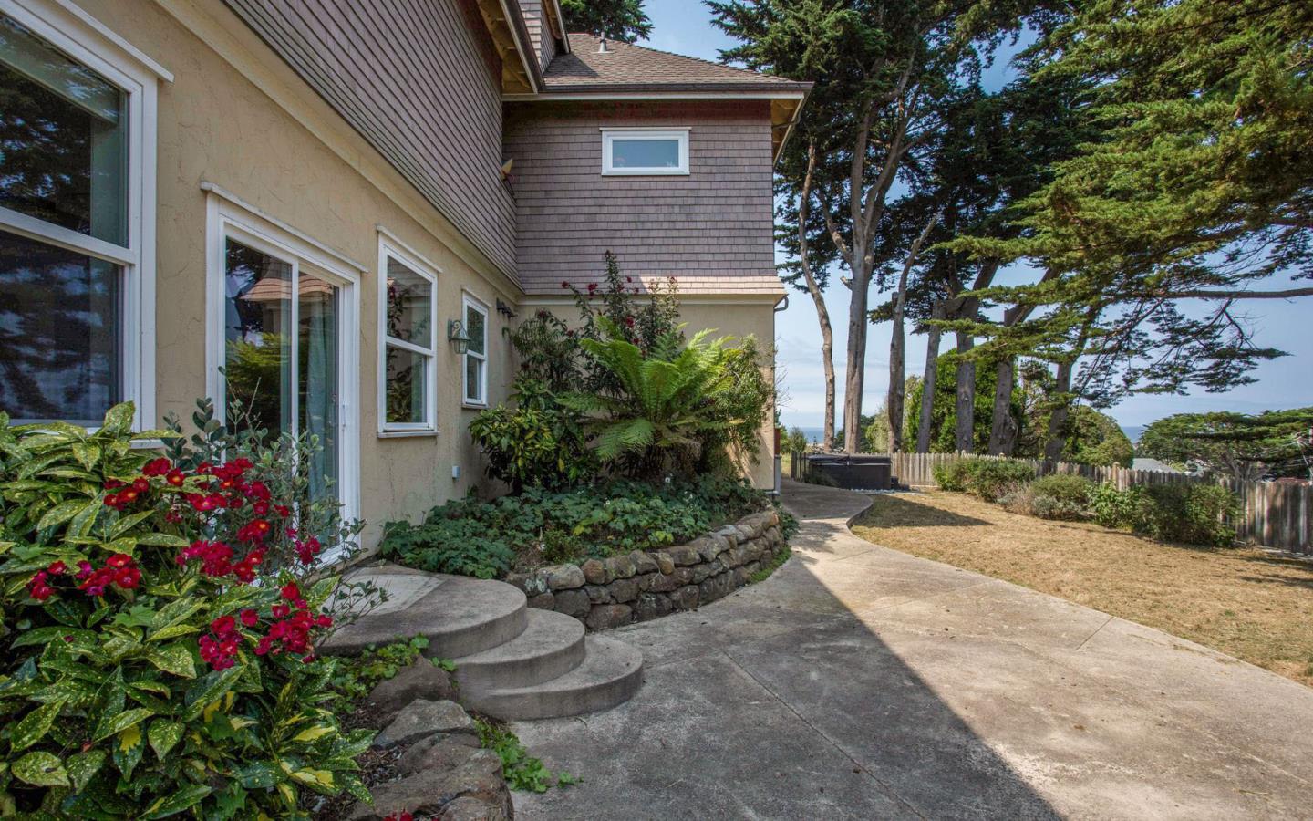 477 Clarendon Road Pacifica, CA 94044 - Photo 17 of 22 a view of a house with potted plants