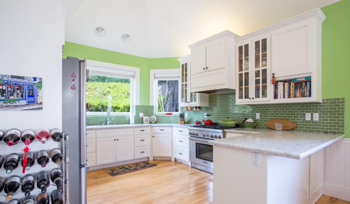 477 Clarendon Road Pacifica, CA 94044 - Photo 3 of 22 a kitchen with a sink stove and cabinets