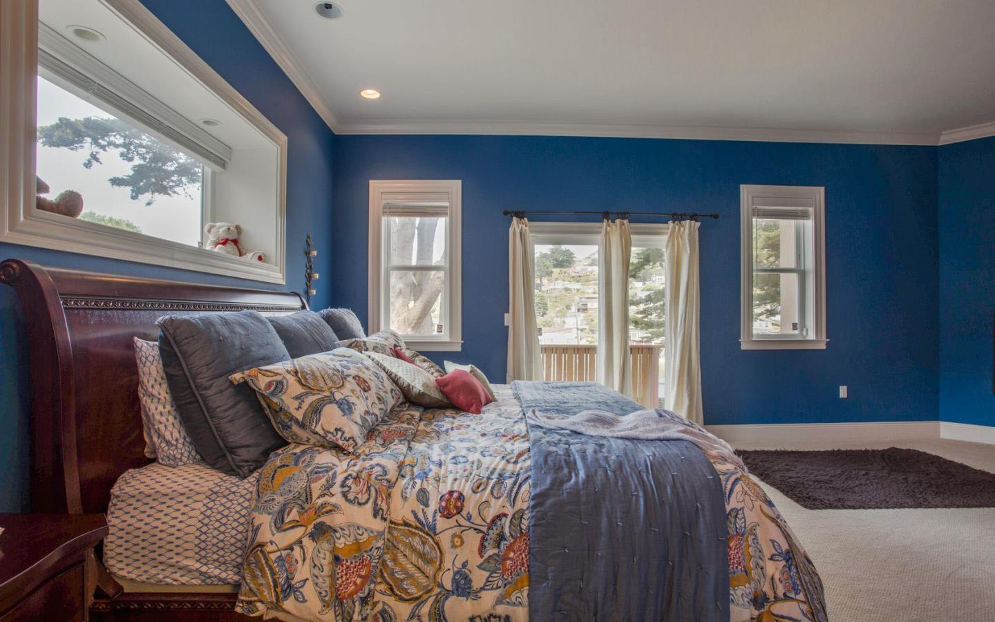 477 Clarendon Road Pacifica, CA 94044 - Photo 9 of 22 a bedroom with a bed and window