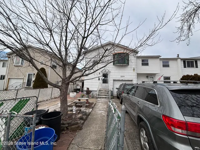 a view of a car parked in front of a house