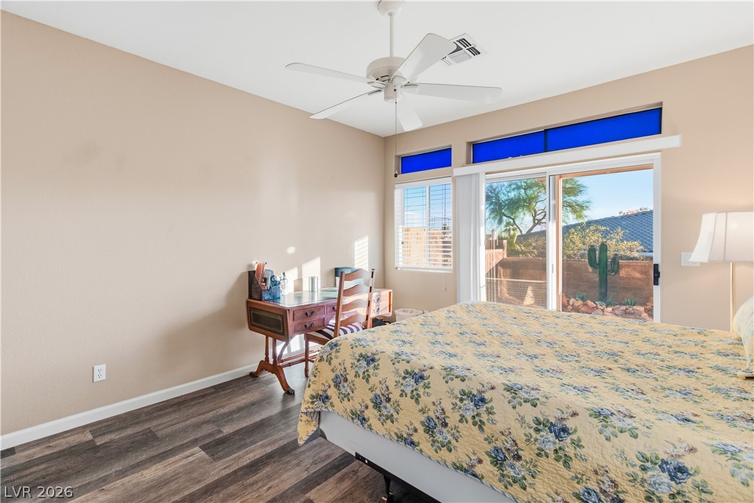 3350 Pheasant Canyon Way, Unit 1008 Laughlin, NV 89029 - Photo 22 of 80 Bedroom with access to exterior, dark wood finished floors, and a ceiling fan