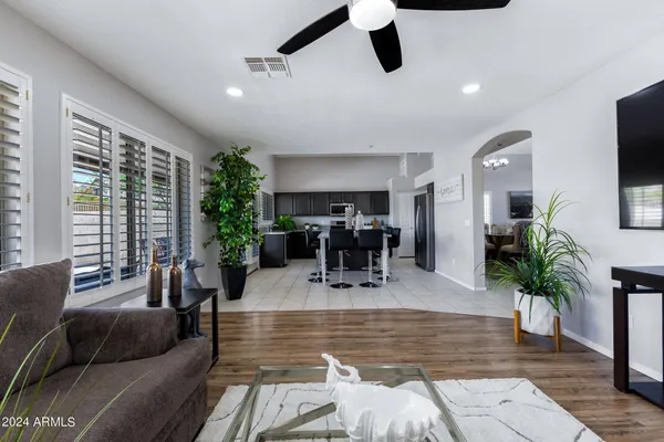 a view of a livingroom with furniture and a floor to ceiling window