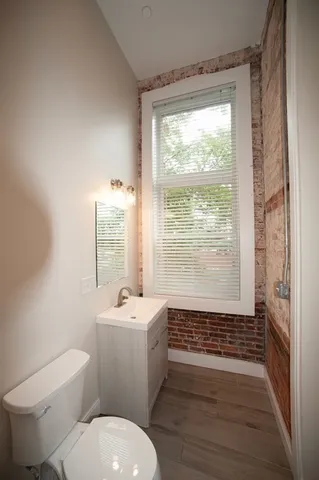 a bathroom with a sink toilet a shower and a mirror