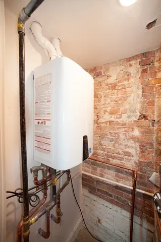 a bathroom with a window and a shower