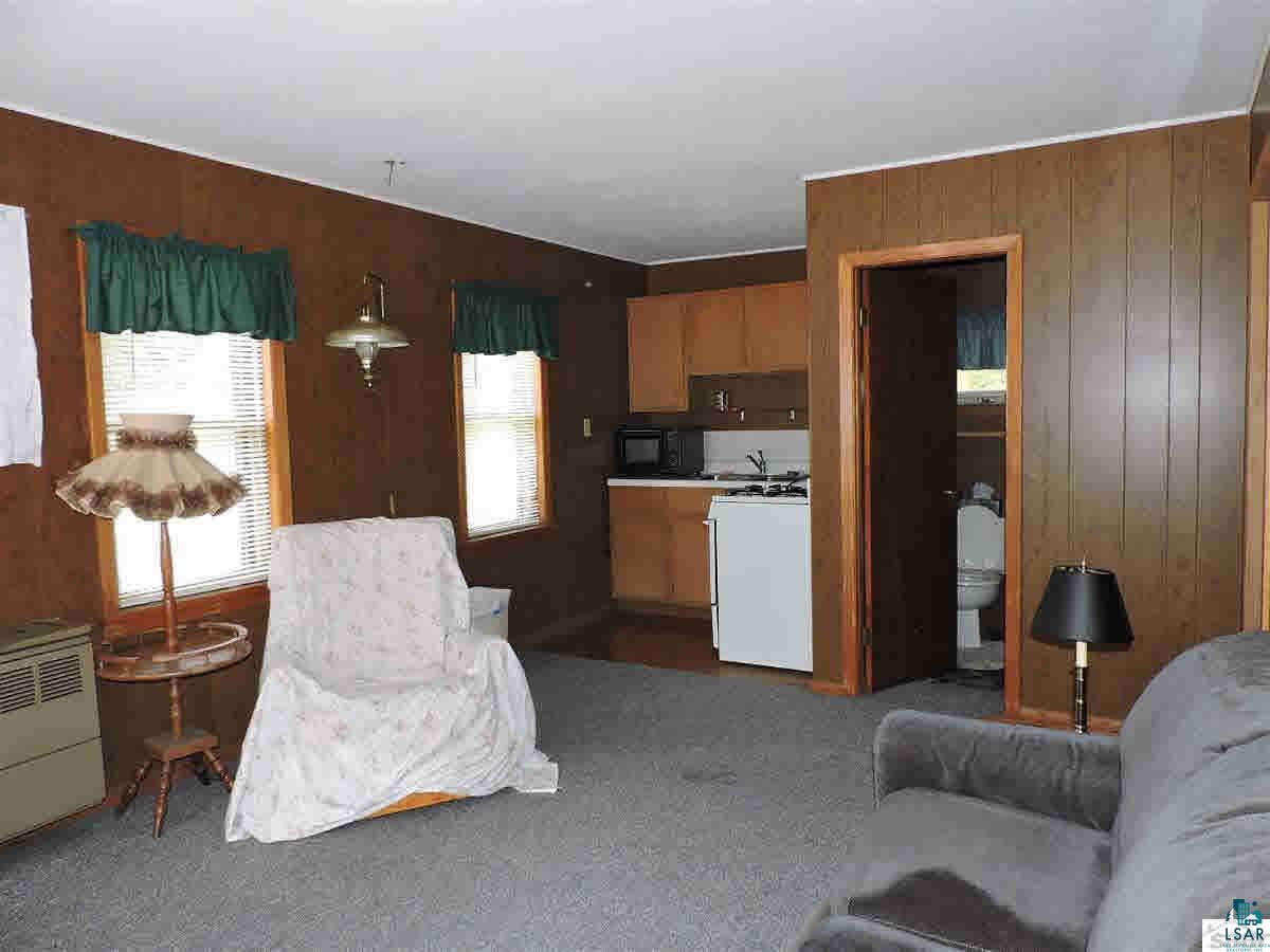 23214 Clam Lake Road Clam Lake, WI 54517 - Photo 12 of 19 Guest cabin living room.