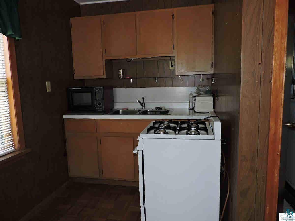 23214 Clam Lake Road Clam Lake, WI 54517 - Photo 13 of 19 Guest cabin kitchen.