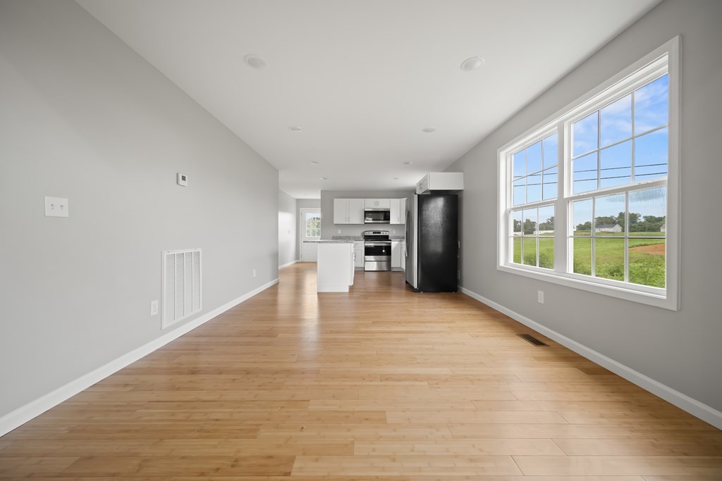 2236 Sullivan Knowles Road Sparta, TN 38583 - Photo 5 of 16 a view of empty room with wooden floor and a window