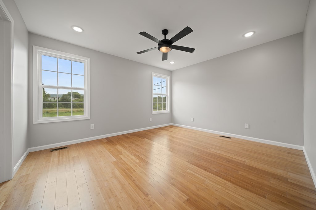 2236 Sullivan Knowles Road Sparta, TN 38583 - Photo 7 of 16 wooden floor in an empty room with a window