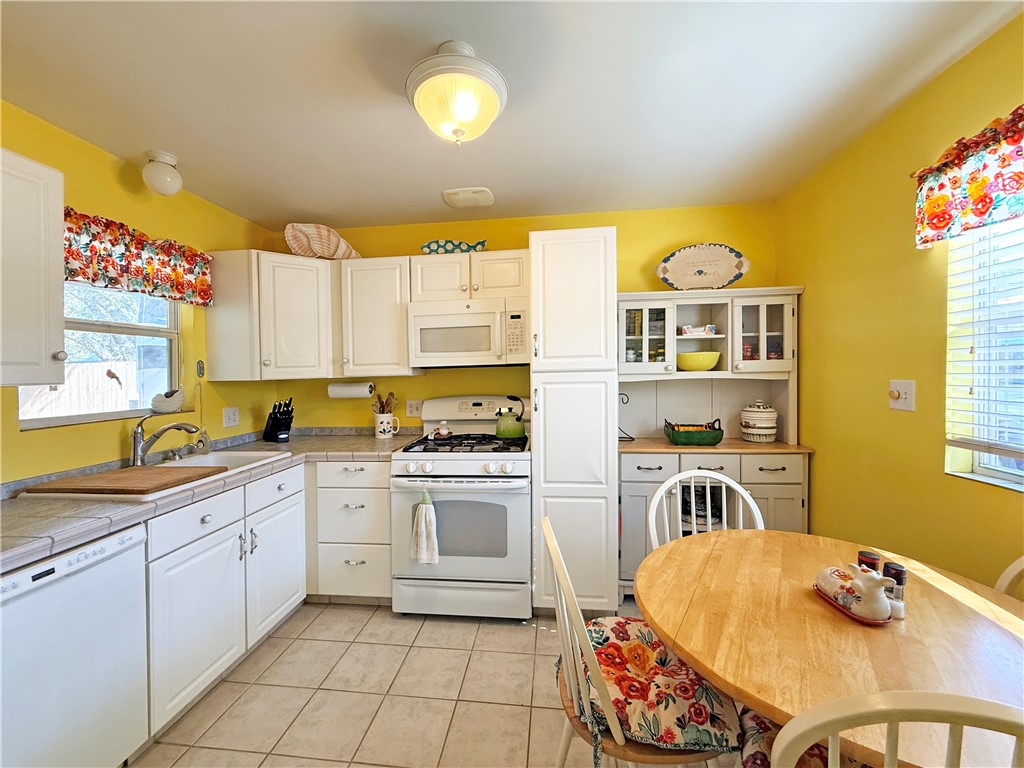 1411 Myrtle Street Fulton, TX 78358 - Photo 11 of 26 a kitchen with stainless steel appliances granite countertop a sink and cabinets