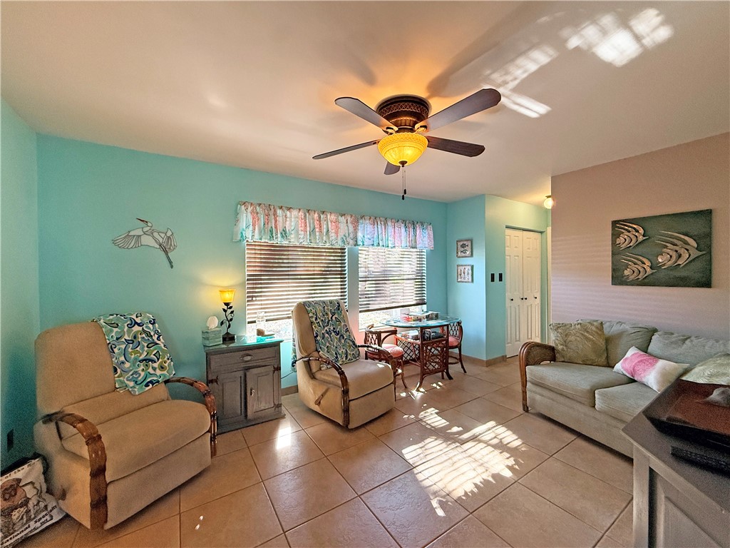 1411 Myrtle Street Fulton, TX 78358 - Photo 12 of 26 a living room with furniture and a large window