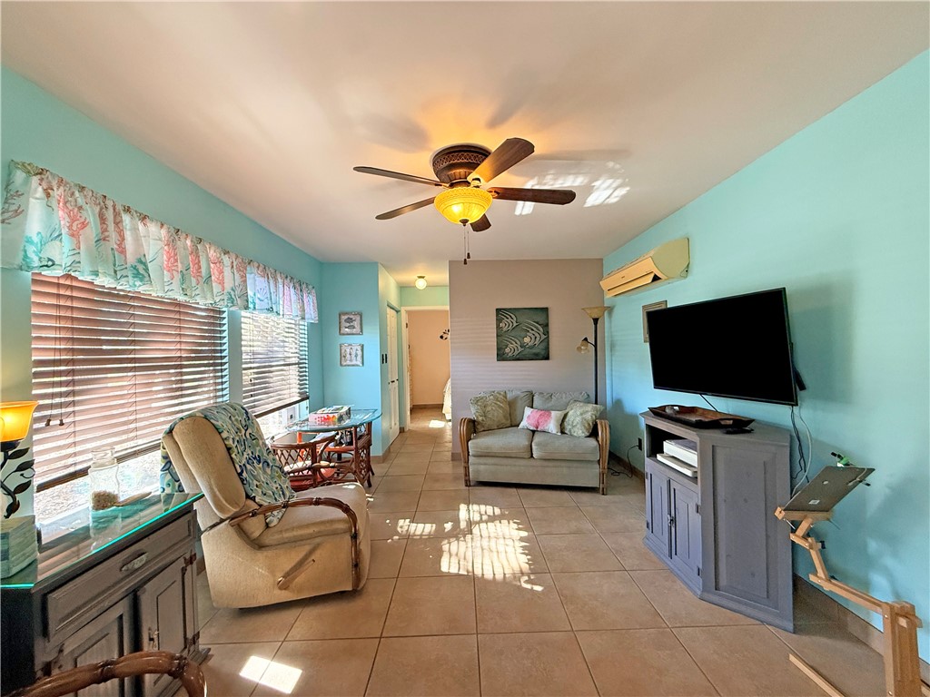 1411 Myrtle Street Fulton, TX 78358 - Photo 13 of 26 a living room with furniture and a flat screen tv