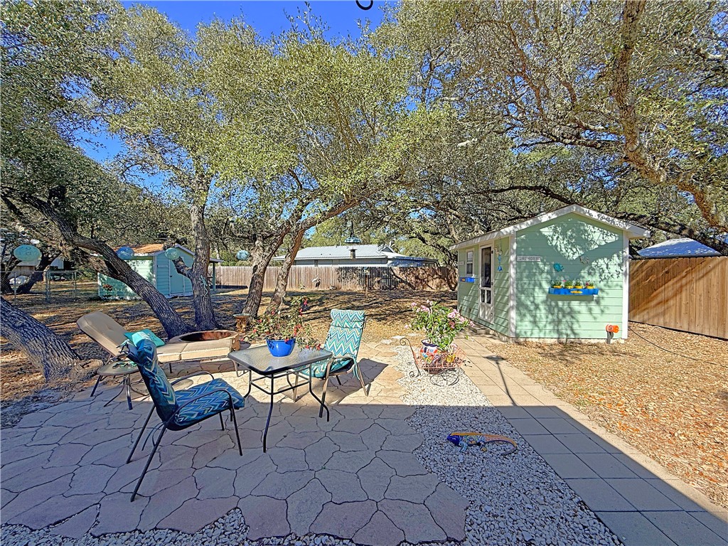 1411 Myrtle Street Fulton, TX 78358 - Photo 19 of 26 a backyard of a house with table and chairs