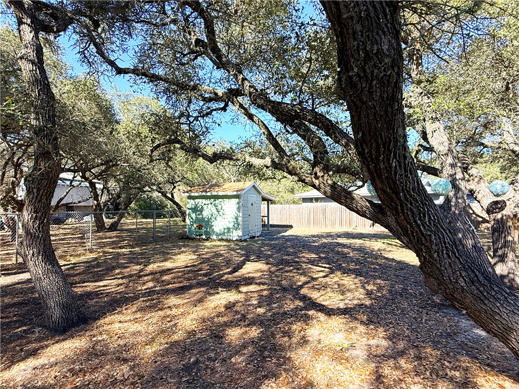 1411 Myrtle Street Fulton, TX 78358 - Photo 21 of 26 a view of a yard with a tree