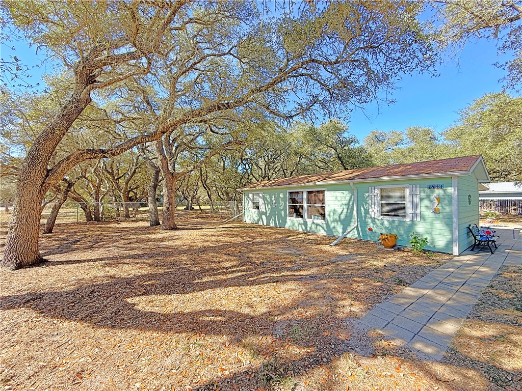 1411 Myrtle Street Fulton, TX 78358 - Photo 3 of 26 a view of a trees in front of a building