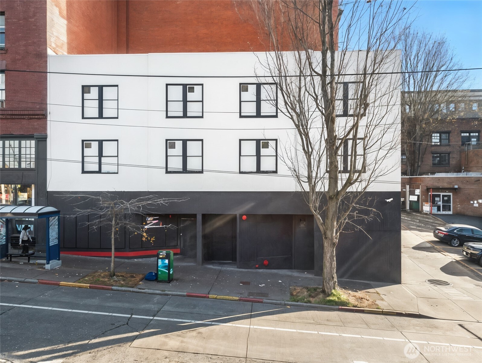 a view of a brick house with many windows