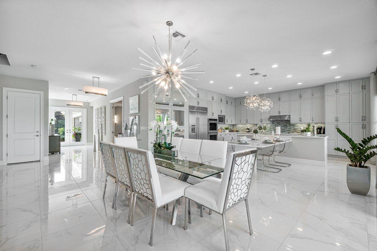 11655 Windy Frst Way Boca Raton, FL 33498 - Photo 12 of 50 a dining room with furniture a chandelier and kitchen view