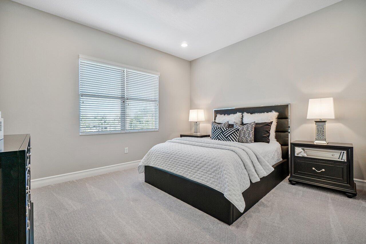 11655 Windy Frst Way Boca Raton, FL 33498 - Photo 15 of 50 a bedroom with a bed and a window