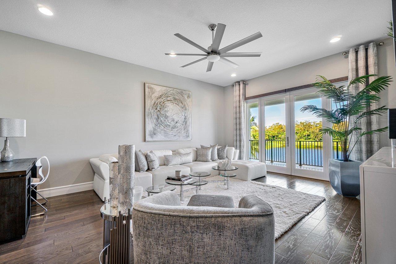 11655 Windy Frst Way Boca Raton, FL 33498 - Photo 17 of 50 a living room with furniture and a large window