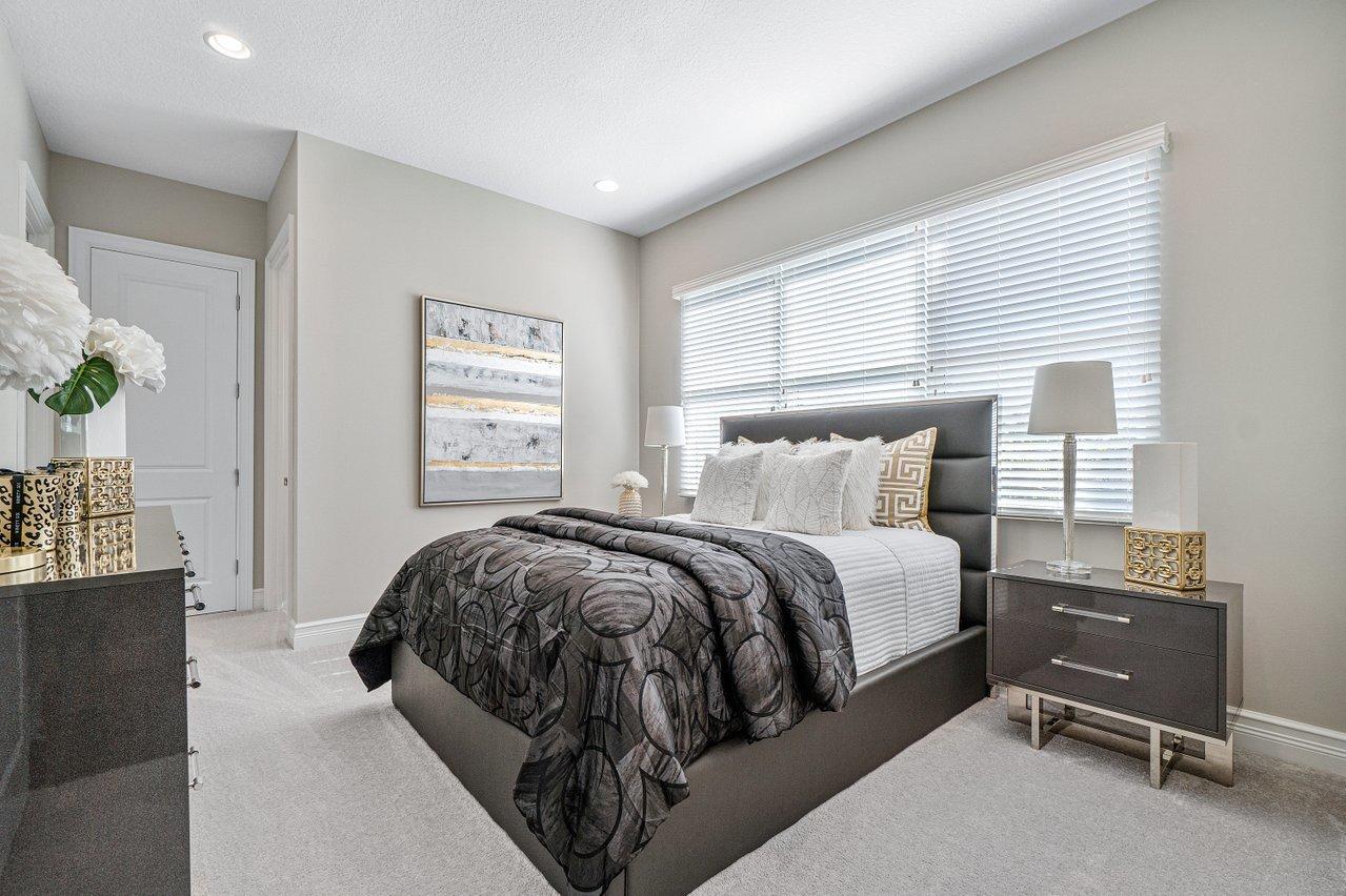 11655 Windy Frst Way Boca Raton, FL 33498 - Photo 19 of 50 a bedroom with a bed and window