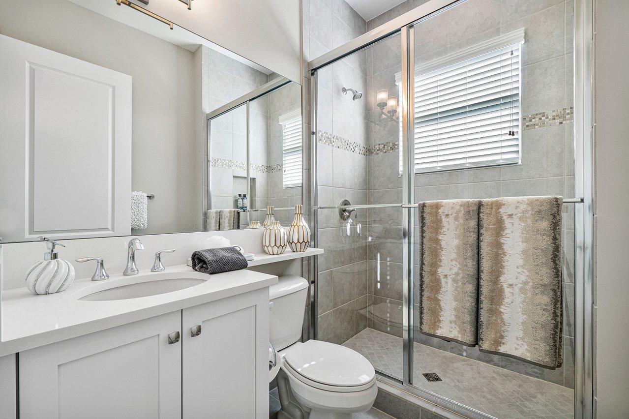 11655 Windy Frst Way Boca Raton, FL 33498 - Photo 20 of 50 a bathroom with a sink toilet and shower