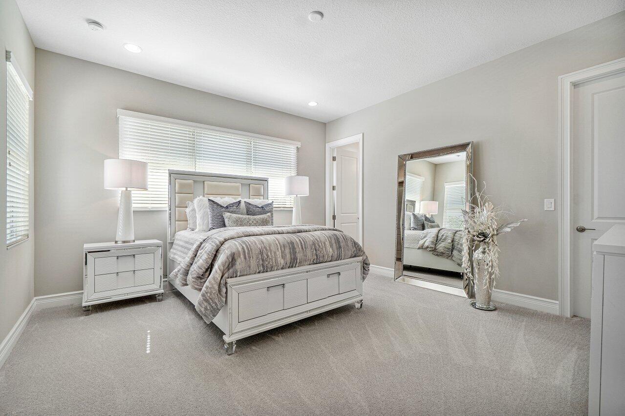 11655 Windy Frst Way Boca Raton, FL 33498 - Photo 21 of 50 a bedroom with a bed and a couch