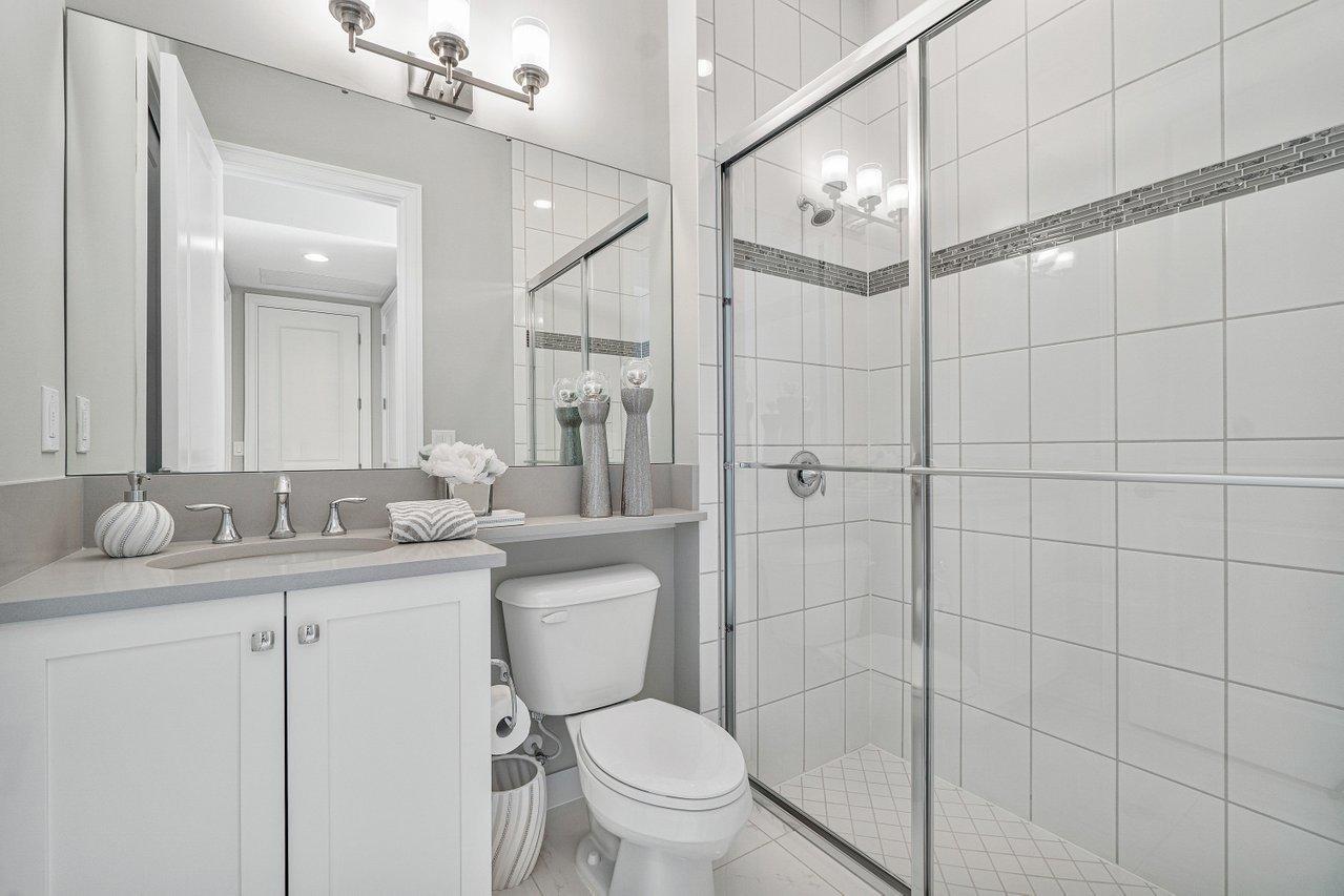 11655 Windy Frst Way Boca Raton, FL 33498 - Photo 29 of 50 a bathroom with a toilet a sink and mirror