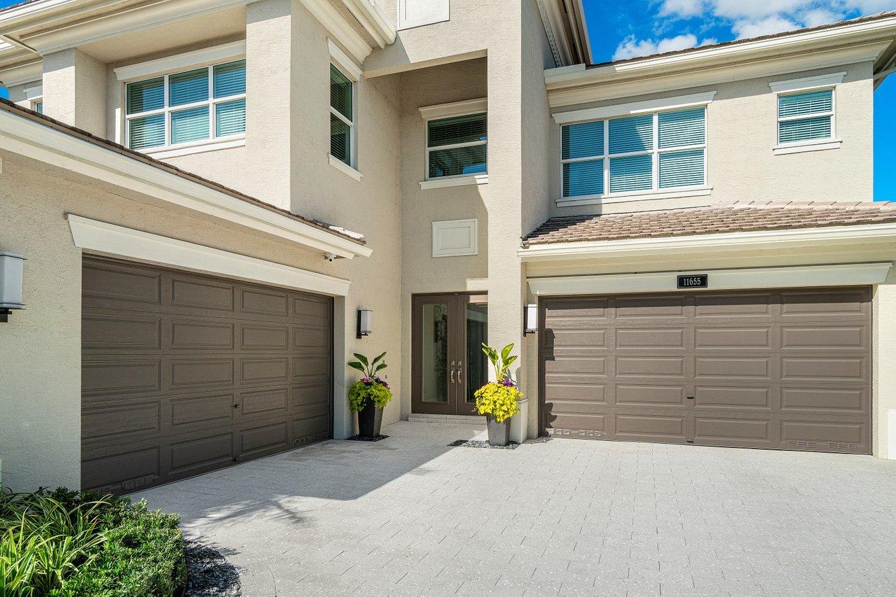 11655 Windy Frst Way Boca Raton, FL 33498 - Photo 3 of 50 a view of parking garage with a chair and table