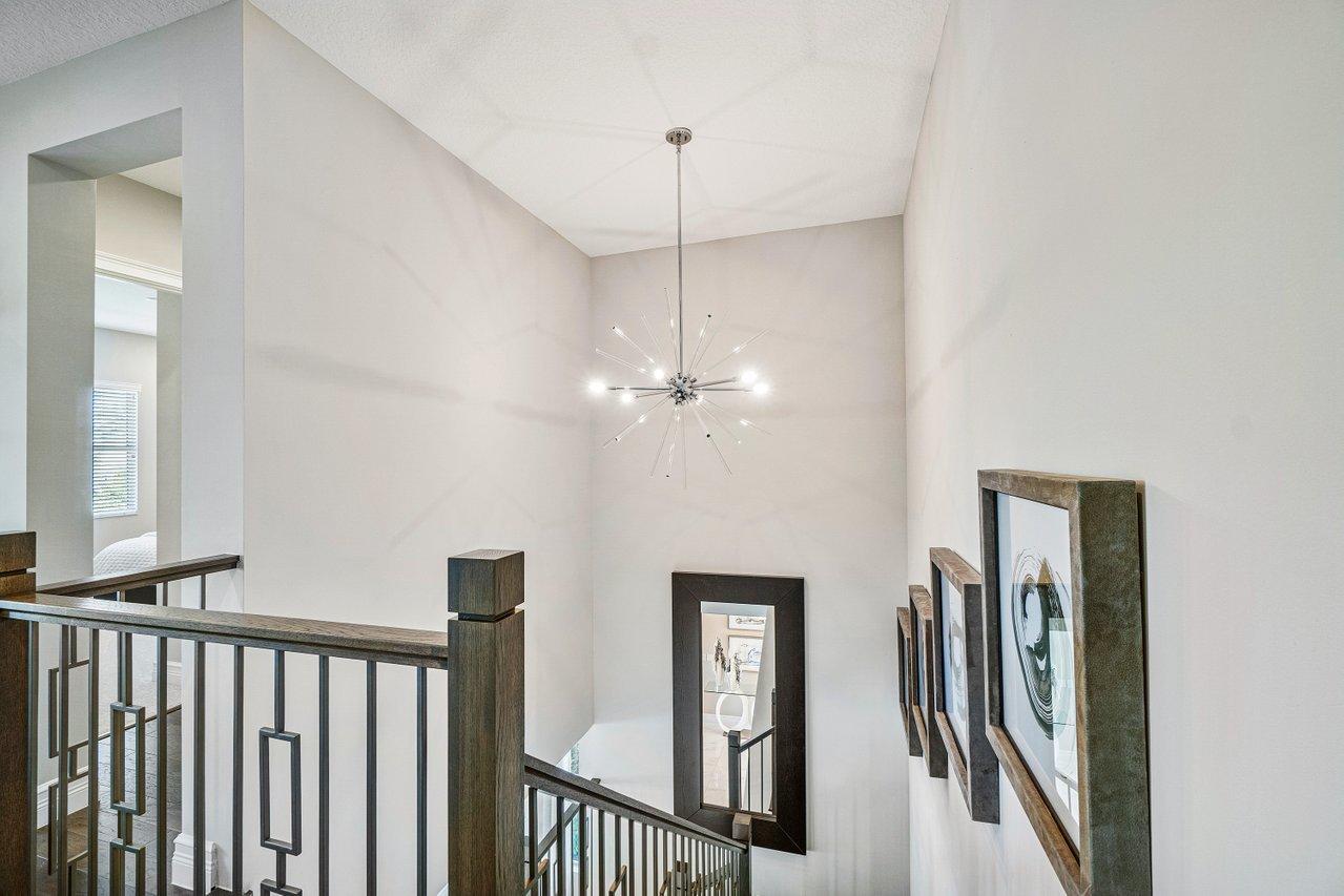 11655 Windy Frst Way Boca Raton, FL 33498 - Photo 31 of 50 a view of a hallway with windows
