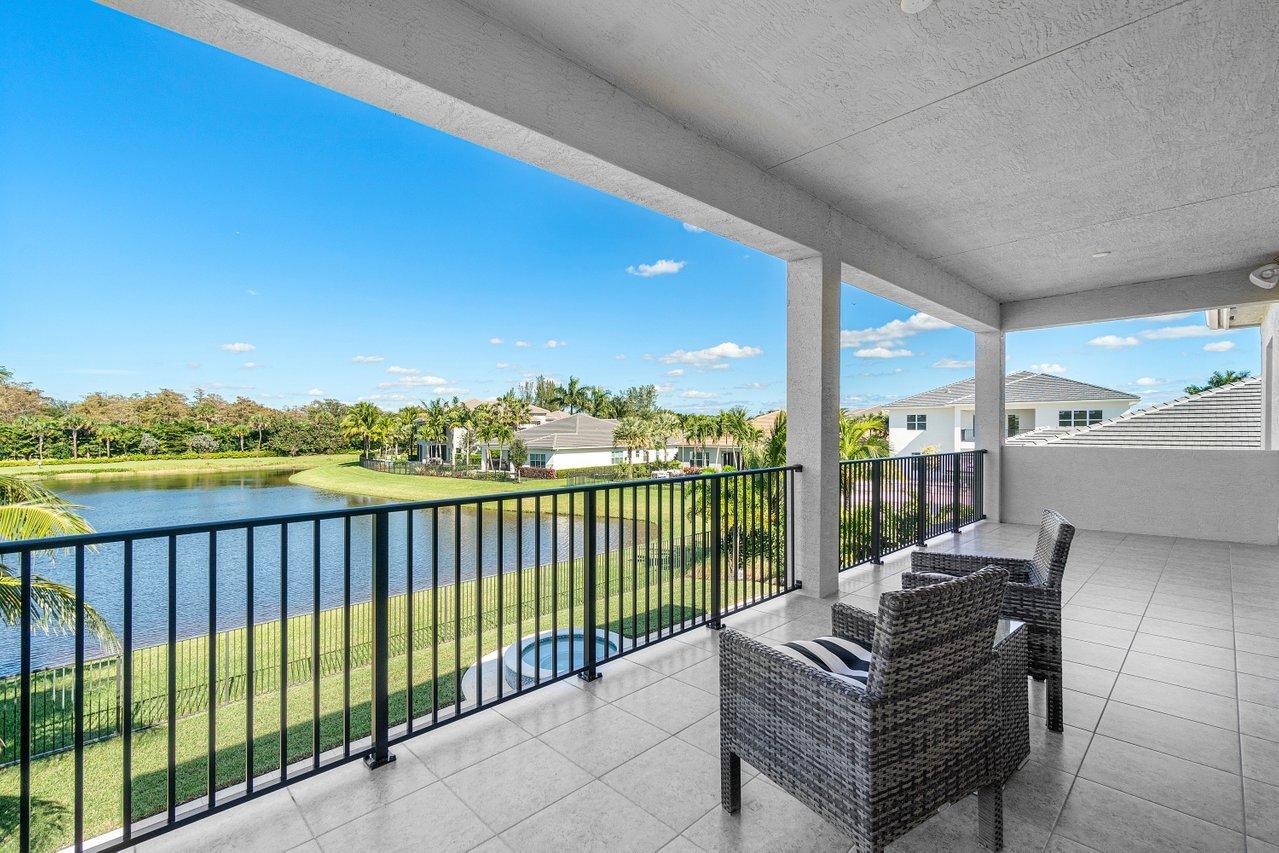 11655 Windy Frst Way Boca Raton, FL 33498 - Photo 32 of 50 a view of a balcony with couches and wooden floor
