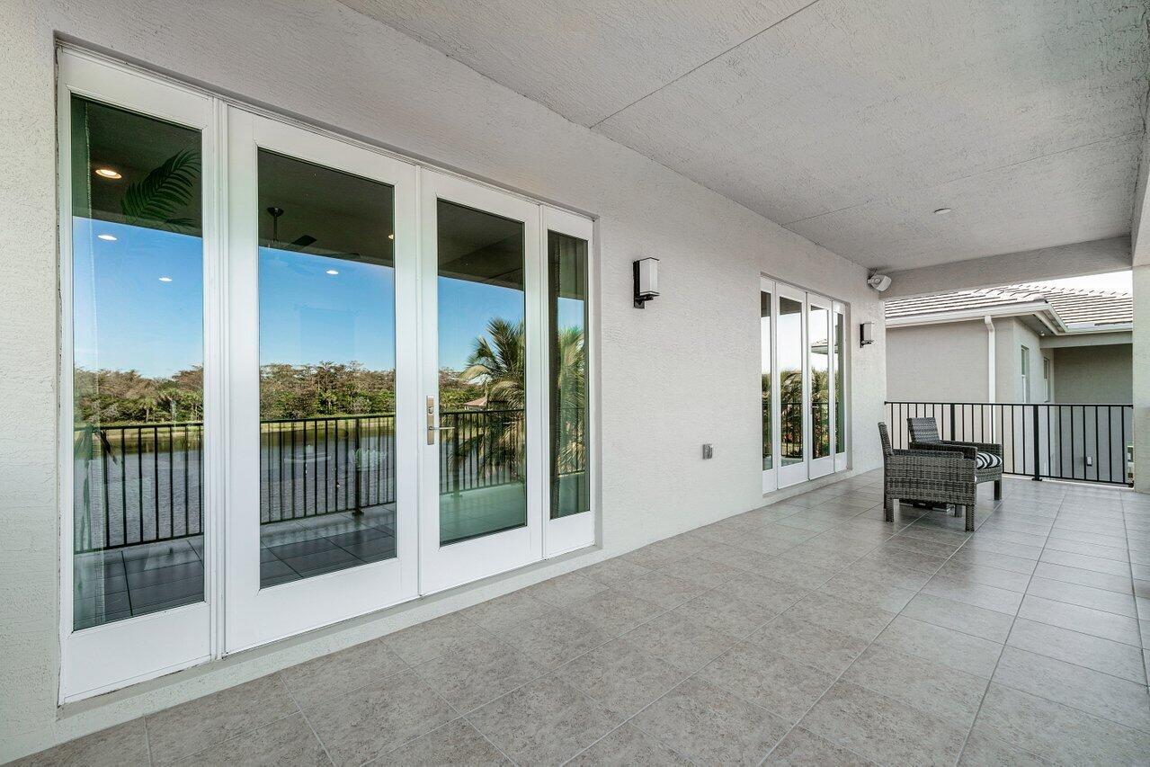 11655 Windy Frst Way Boca Raton, FL 33498 - Photo 34 of 50 a view of livingroom with furniture and floor to ceiling window